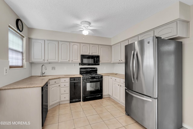 kitchen with black appliances, sink, a textured ceiling, white cabinets, and light tile patterned floors