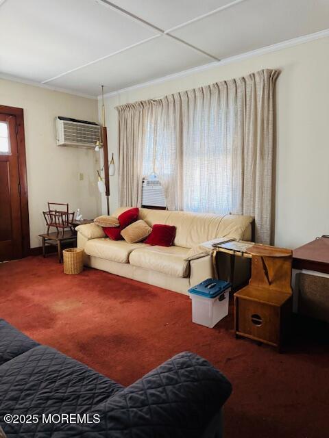 living room with dark colored carpet, ornamental molding, a healthy amount of sunlight, and a wall mounted air conditioner