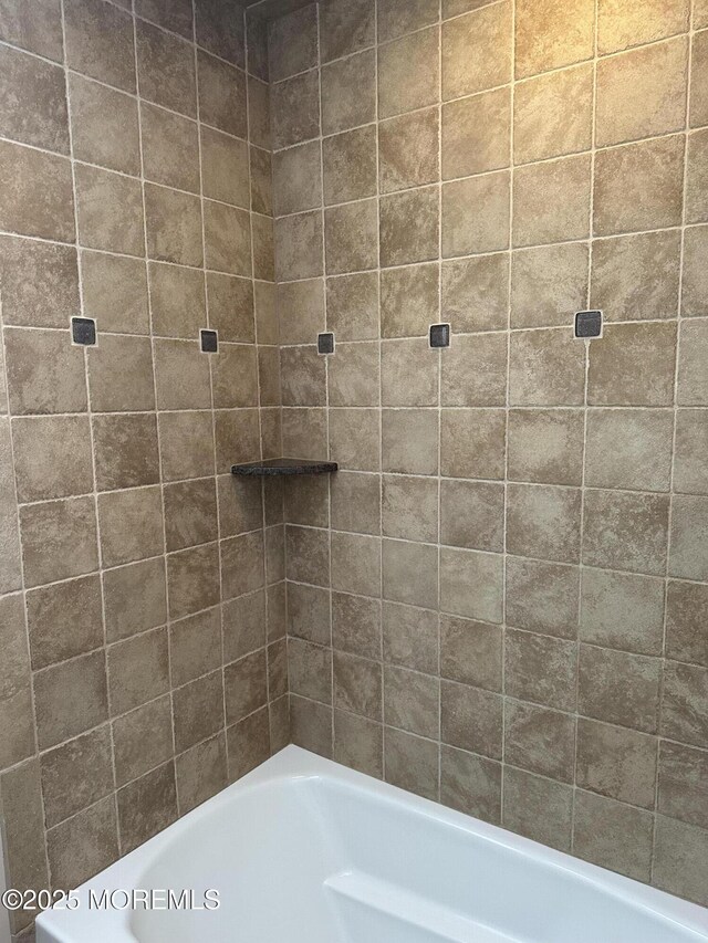 bathroom featuring a tub