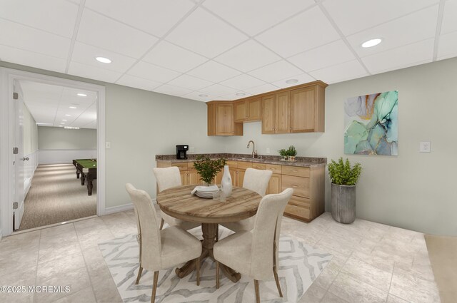 dining space featuring a paneled ceiling and recessed lighting