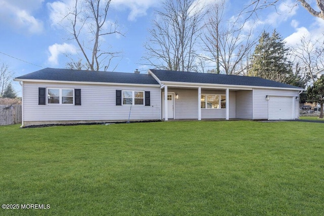 ranch-style house featuring a front lawn and a garage