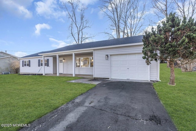 ranch-style home with a front yard, a porch, and a garage