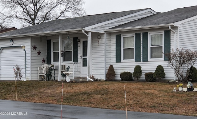 single story home with a front lawn and a garage