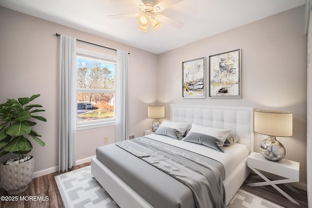 bedroom with ceiling fan and hardwood / wood-style floors