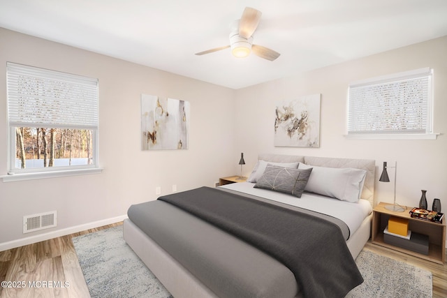 bedroom featuring ceiling fan and hardwood / wood-style floors