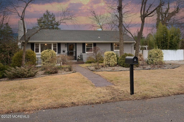 ranch-style house featuring a yard