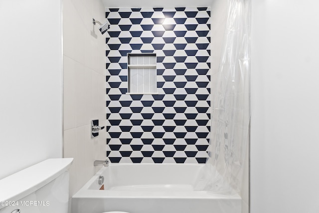 bathroom with toilet and shower / tub combo