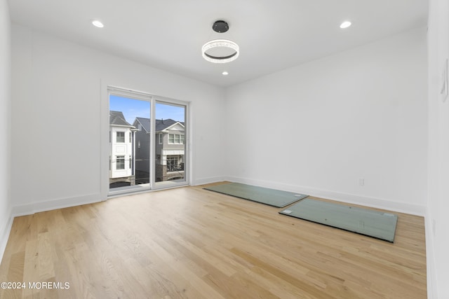 unfurnished room with light hardwood / wood-style floors