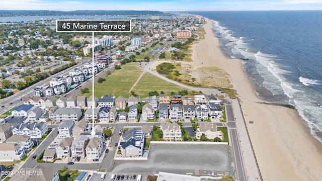 aerial view featuring a beach view and a water view