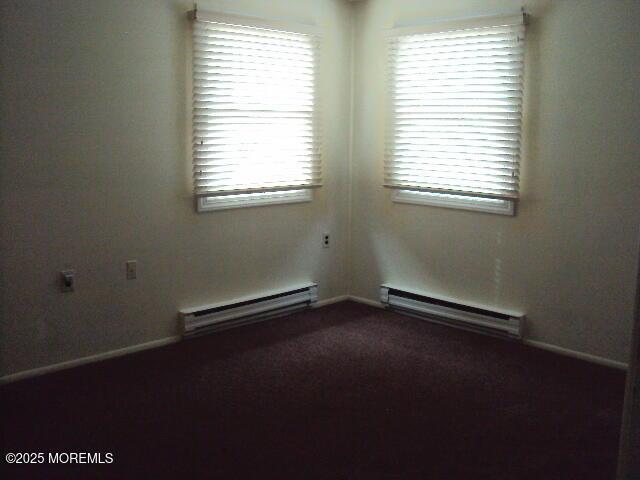 empty room with a baseboard heating unit