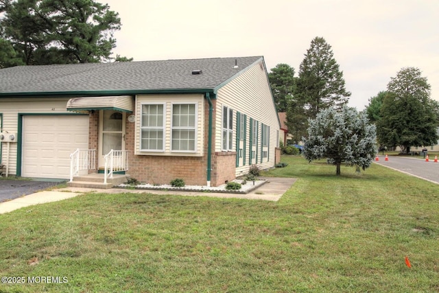 view of front facade with a front lawn and a garage