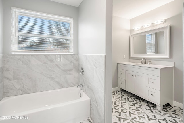 bathroom with a tub to relax in and vanity