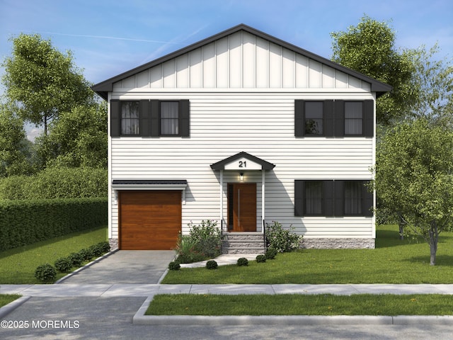 view of front of home featuring a front lawn and a garage