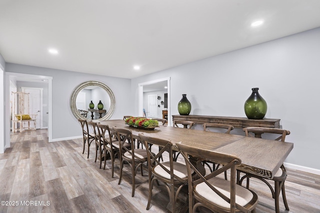 dining room with light hardwood / wood-style flooring