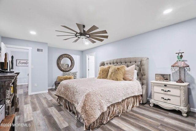 bedroom featuring ceiling fan and hardwood / wood-style flooring