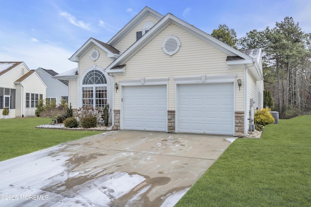 view of front facade featuring a garage and a front lawn