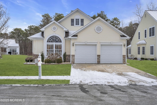 front facade featuring a garage and a front lawn