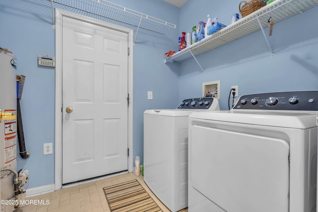 laundry area featuring separate washer and dryer and water heater