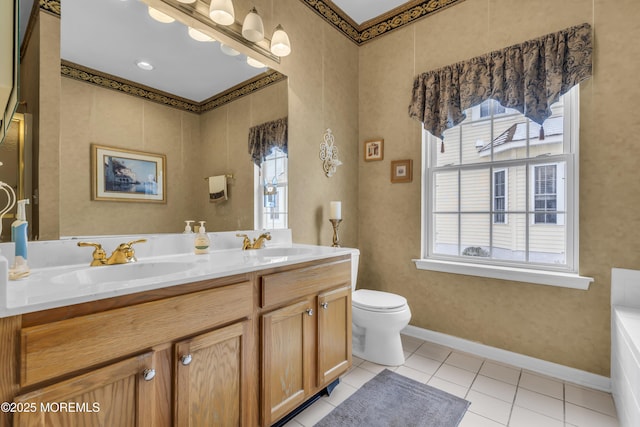 bathroom with tile patterned flooring, vanity, and toilet