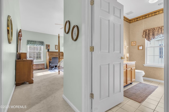 corridor with light colored carpet