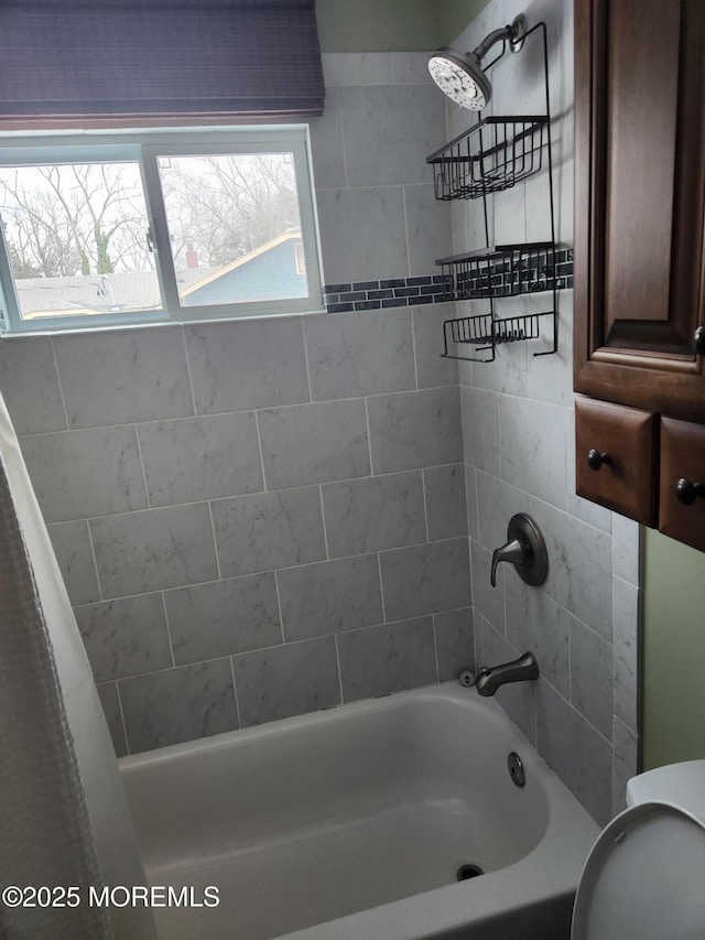 bathroom featuring shower / bath combination with curtain