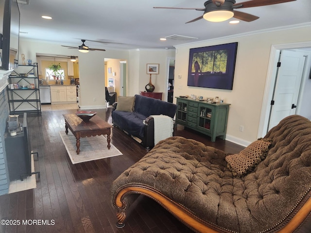 living room with crown molding, ceiling fan, and dark hardwood / wood-style floors