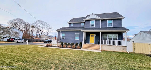 view of front of home featuring covered porch and a front lawn