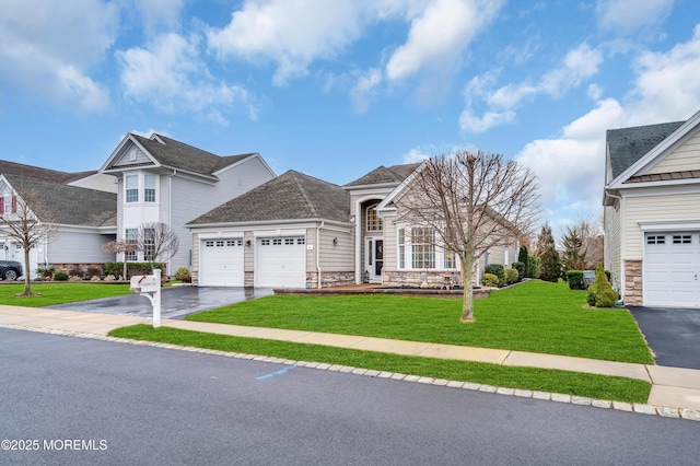 view of front facade with a garage and a front yard