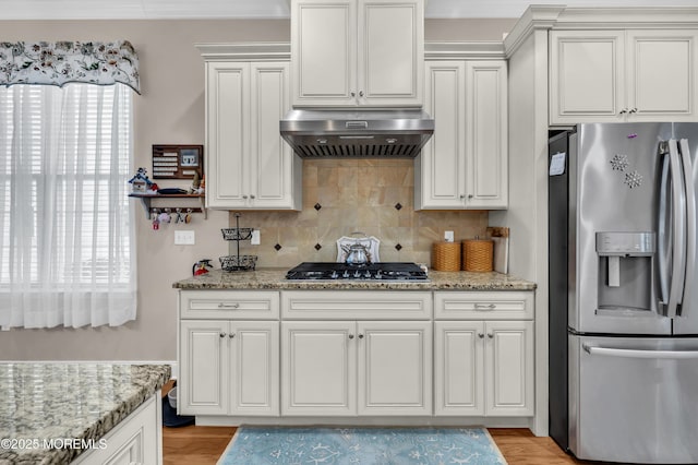 kitchen with range hood, stainless steel appliances, and white cabinetry