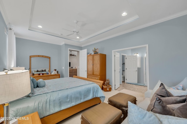 bedroom with a raised ceiling, ceiling fan, and ornamental molding