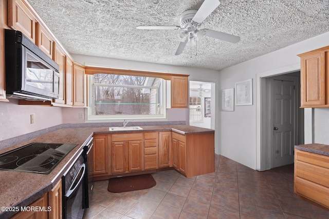 kitchen with ceiling fan, sink, black appliances, and tile patterned flooring