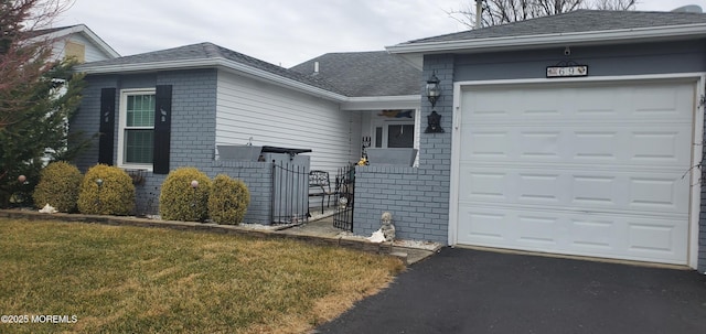 exterior space with a garage and a front yard