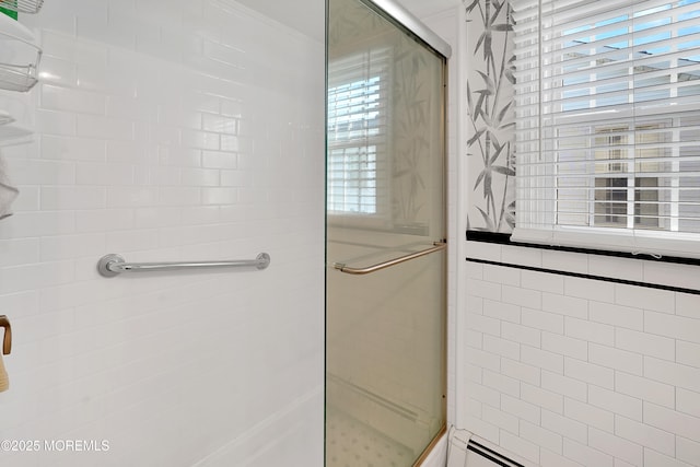 bathroom with a baseboard radiator and an enclosed shower