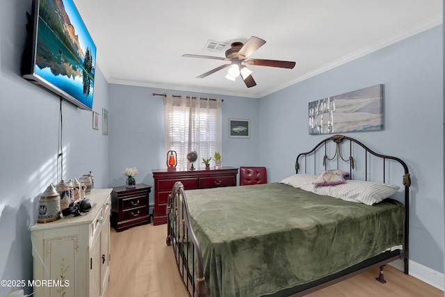 bedroom featuring crown molding, ceiling fan, and light hardwood / wood-style flooring