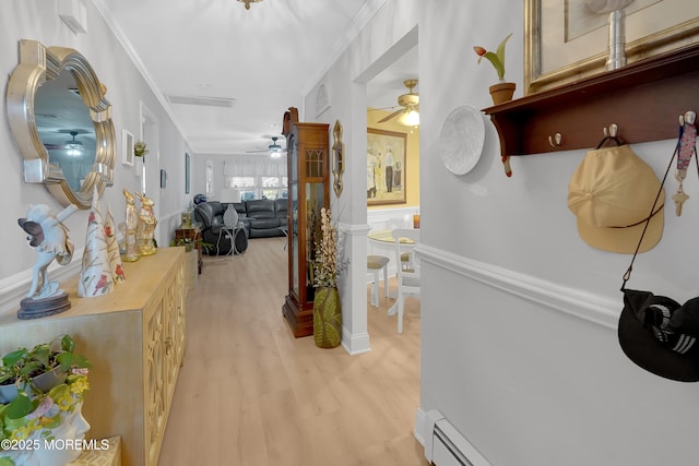 corridor featuring light hardwood / wood-style flooring and ornamental molding