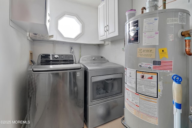 laundry room with cabinets, gas water heater, and washing machine and dryer