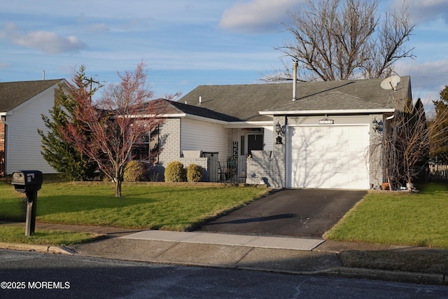 ranch-style house with a garage and a front lawn