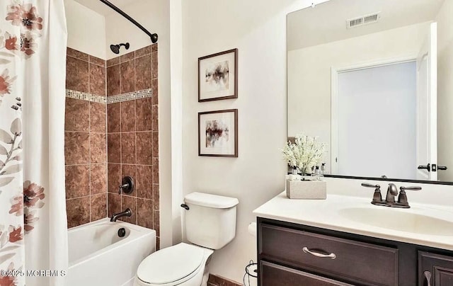 full bathroom featuring shower / bath combo with shower curtain, toilet, and vanity