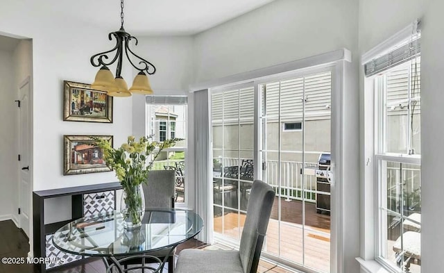 dining area featuring an inviting chandelier