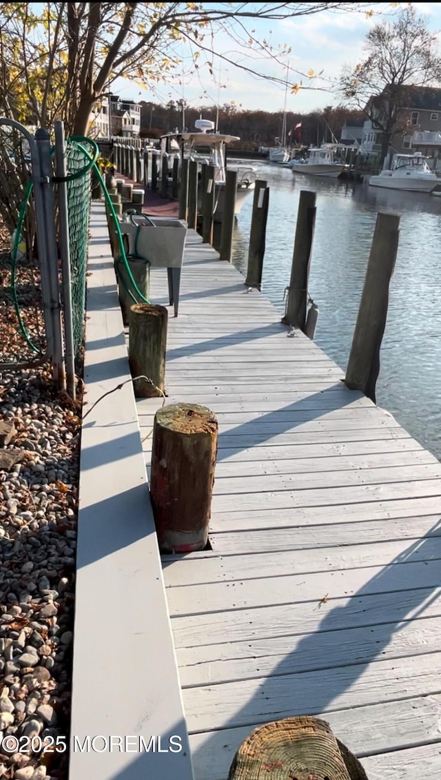 view of dock featuring a water view