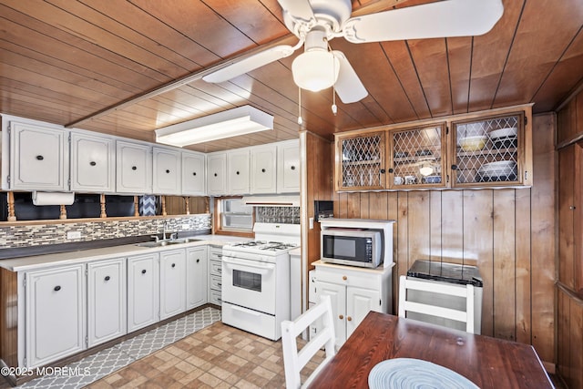 kitchen with white cabinetry, sink, white range with gas stovetop, and wooden ceiling