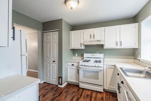 kitchen featuring white gas stove, dark hardwood / wood-style flooring, white cabinetry, and sink