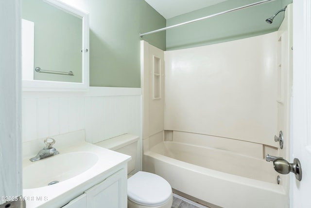 full bathroom with shower / bathing tub combination, toilet, and vanity