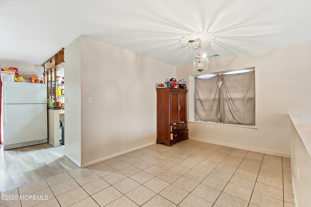 empty room featuring light tile patterned floors