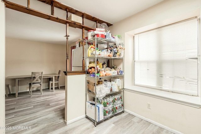 kitchen with hardwood / wood-style flooring and refrigerator