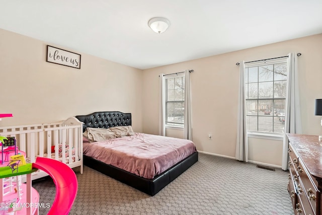 bedroom featuring light colored carpet