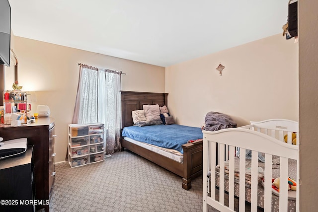 bedroom with light colored carpet