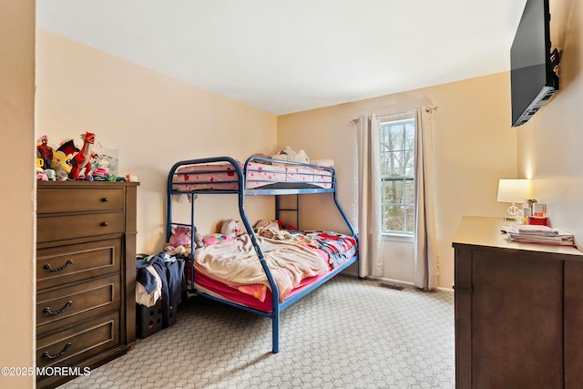 bedroom with light colored carpet