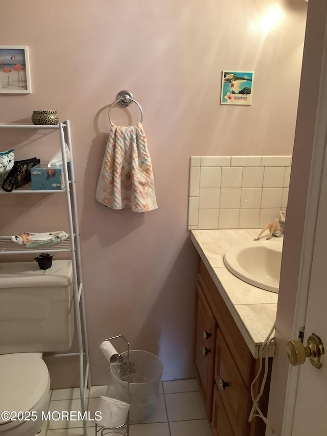 bathroom with tile patterned floors, vanity, and toilet