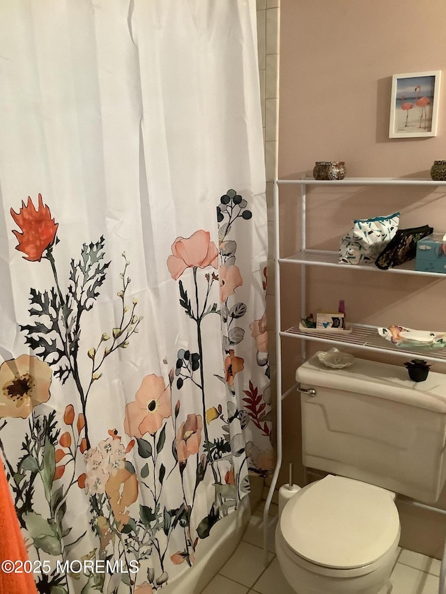 bathroom featuring toilet and tile patterned floors